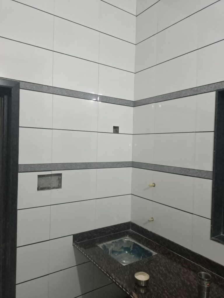 Kitchen wall tiles installation by Lalchand Saini tile contractor in Vadodara